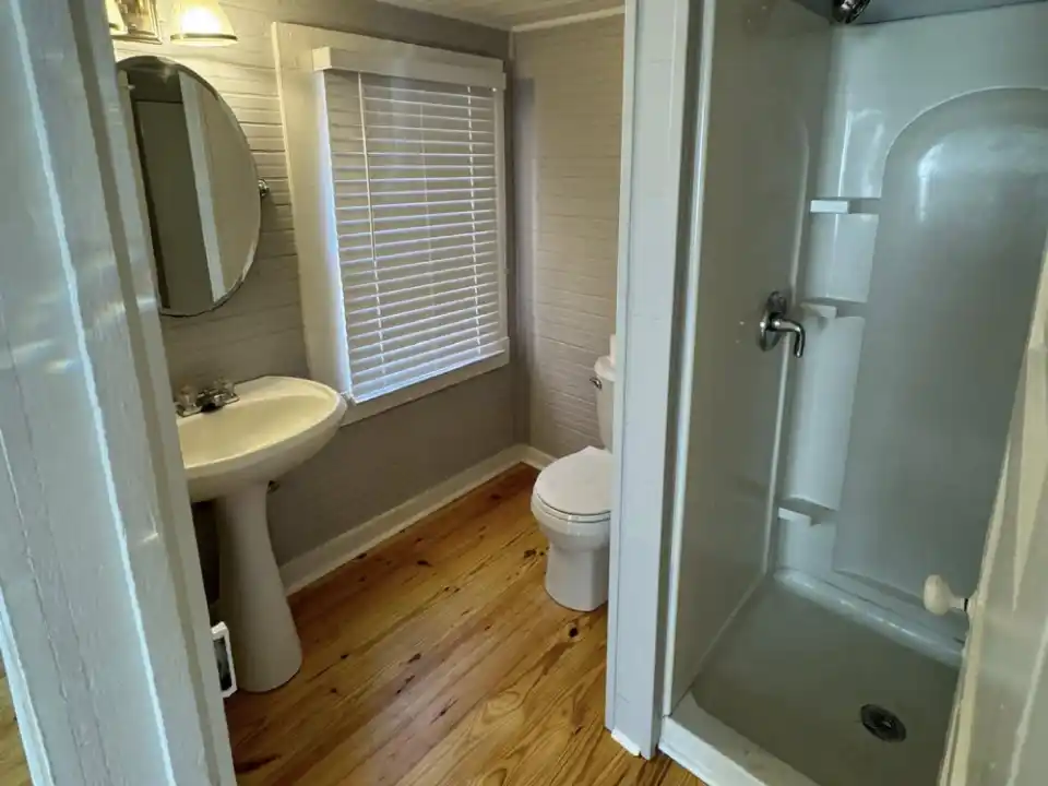 Inside bathroom showing plumbing in single building in Lafayette, Louisiana